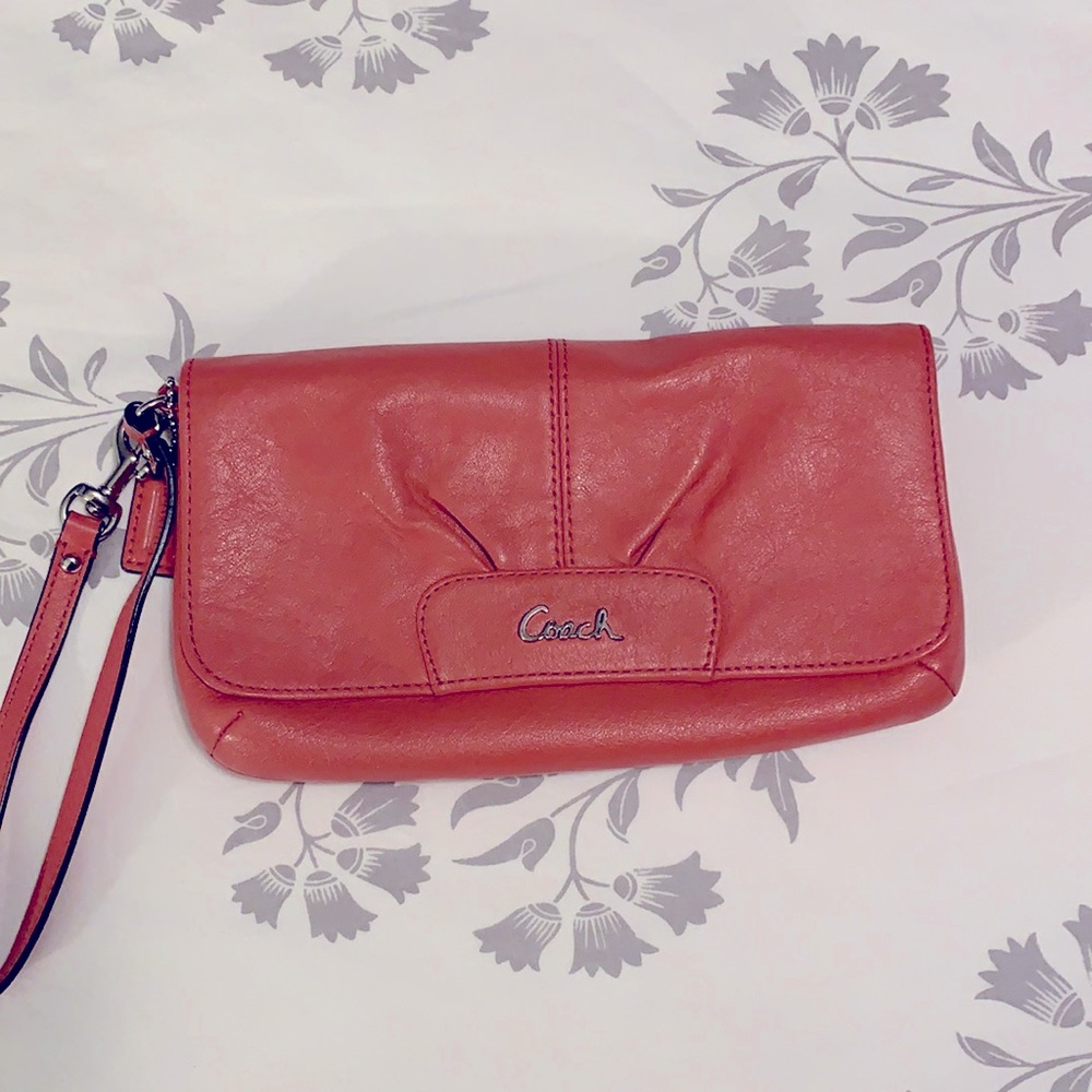 Coach coral/peach leather wristlet w/ silver